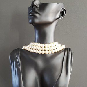 Three-row faux pearl necklace.